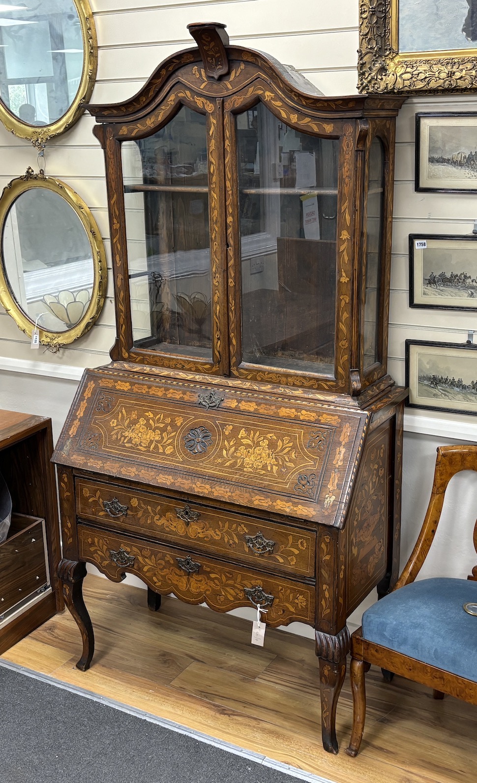 An early 19th century and later Dutch oak and walnut floral marquetry inlaid bureau bookcase, width 98cm, depth 48cm, height 192cm